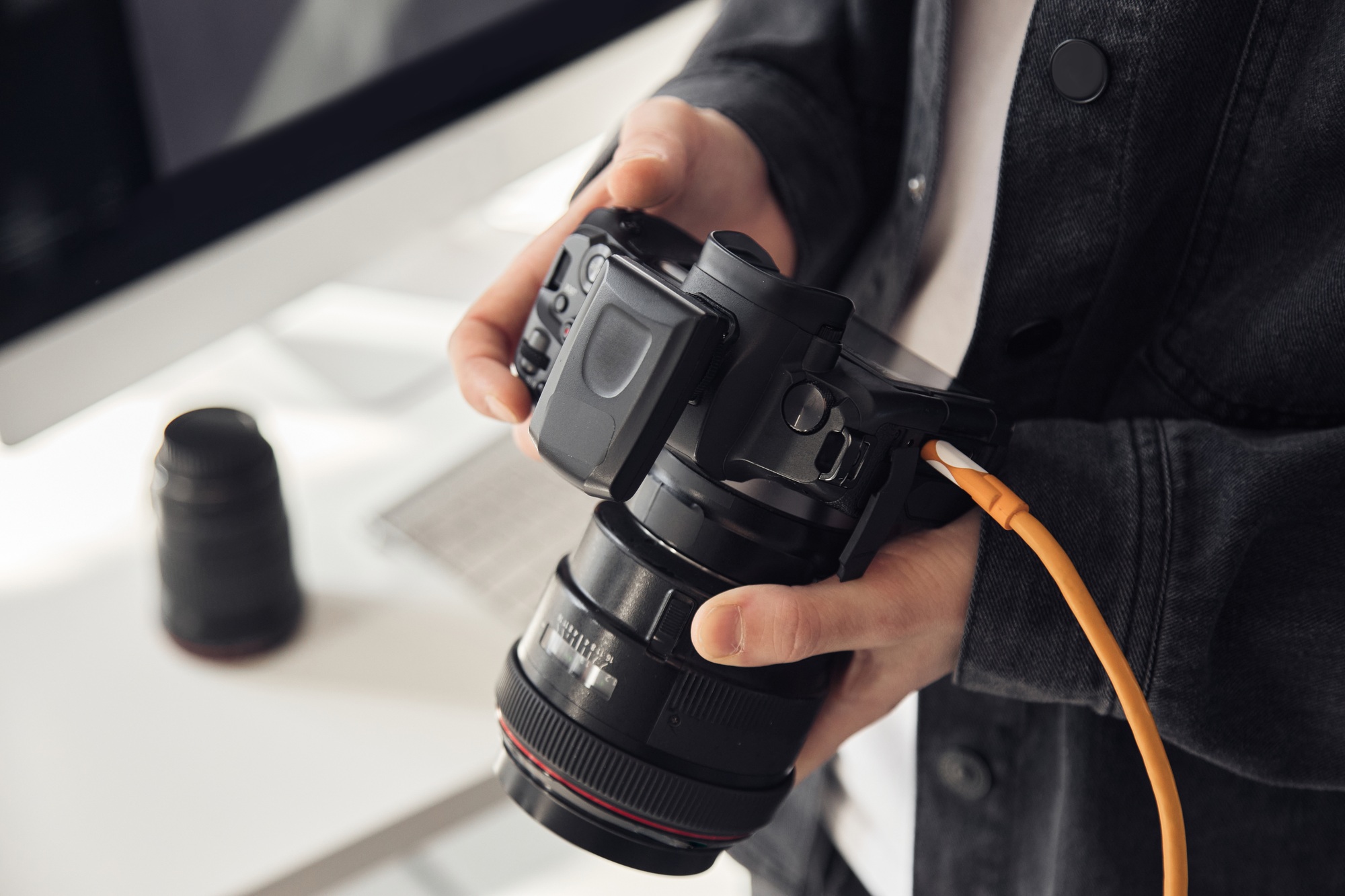 Man Holding Pro Photo Camera